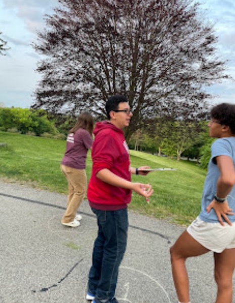 Students outside of the observatory doing an activity