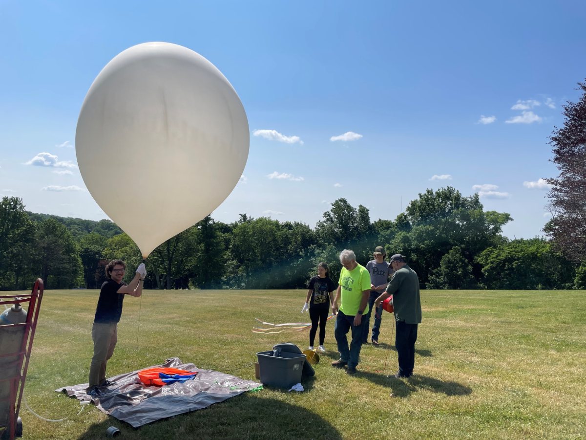 people prepping a balloon